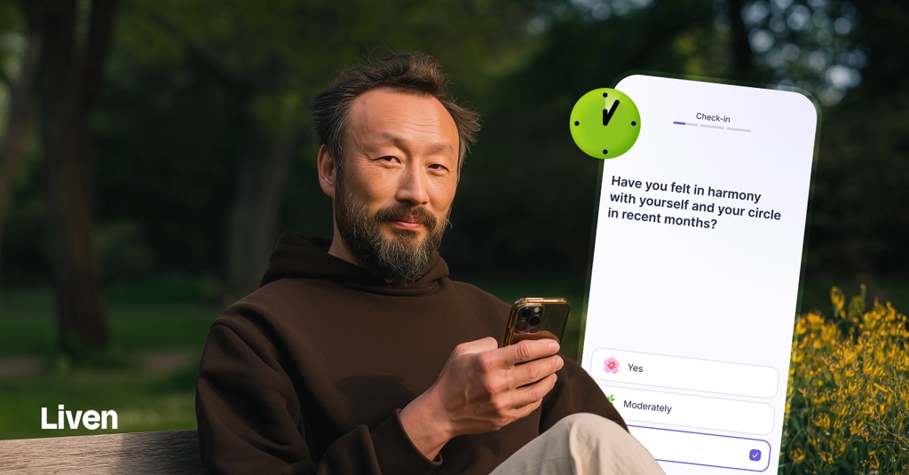 man using Liven app on phone at park