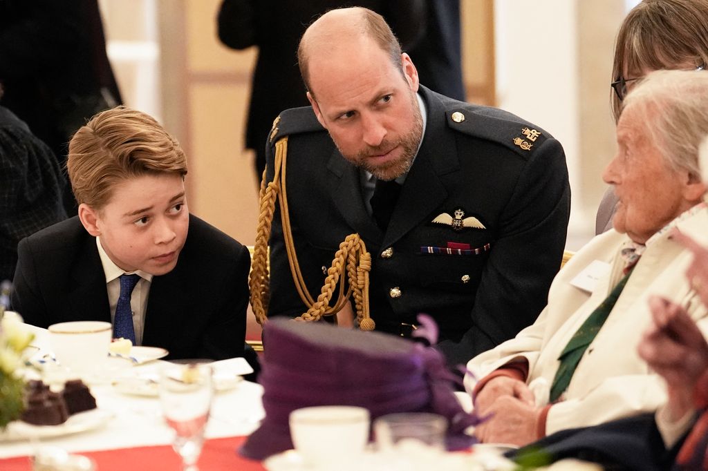 Prince George and Prince William listening to veterans