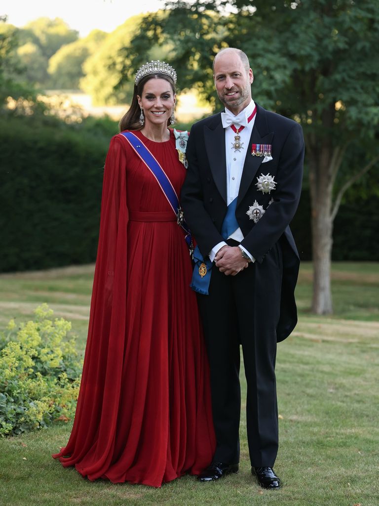 Kate in red caped gown and William in white tie ahead of French state banquet