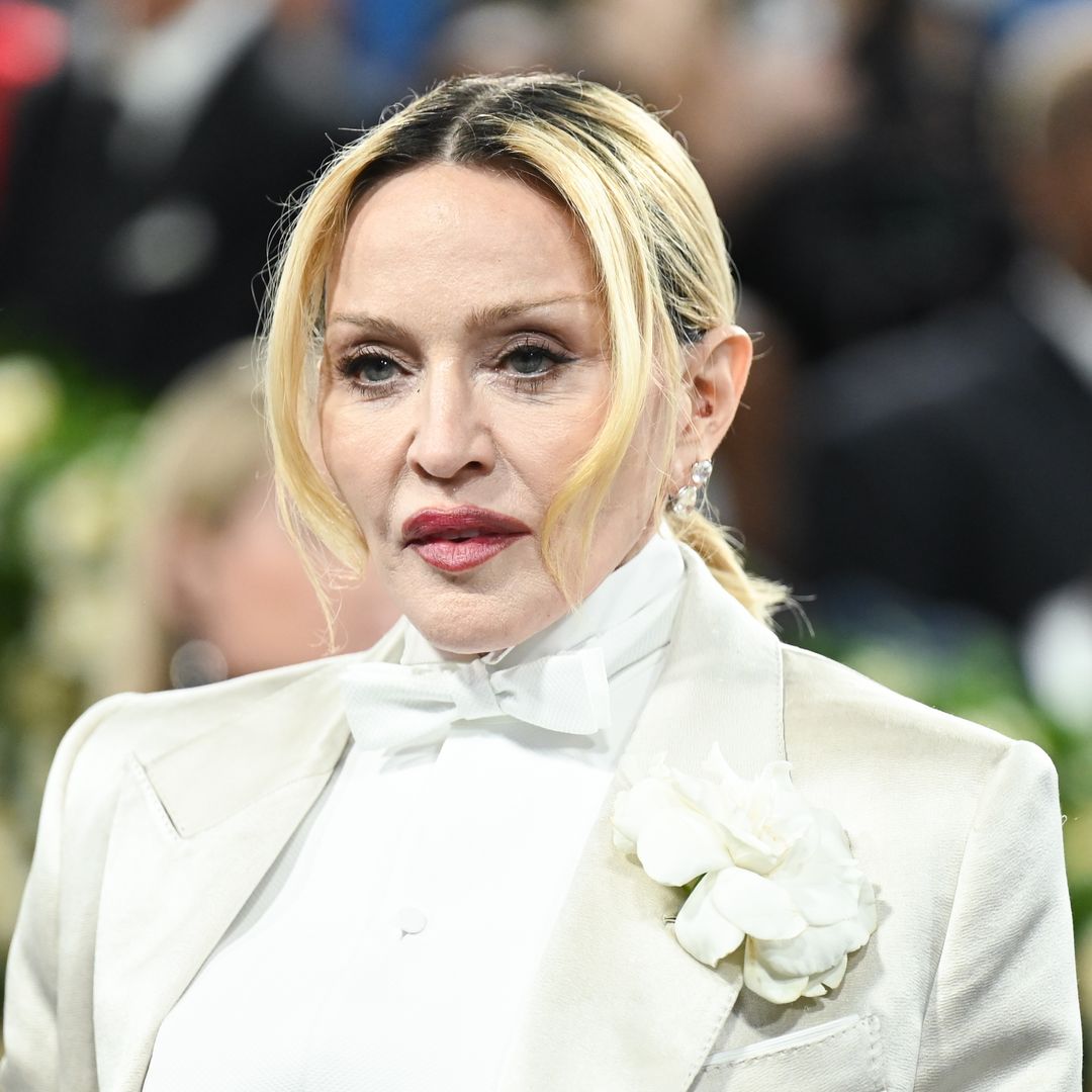 Madonna surrounded by her children in new family portrait, with one missing