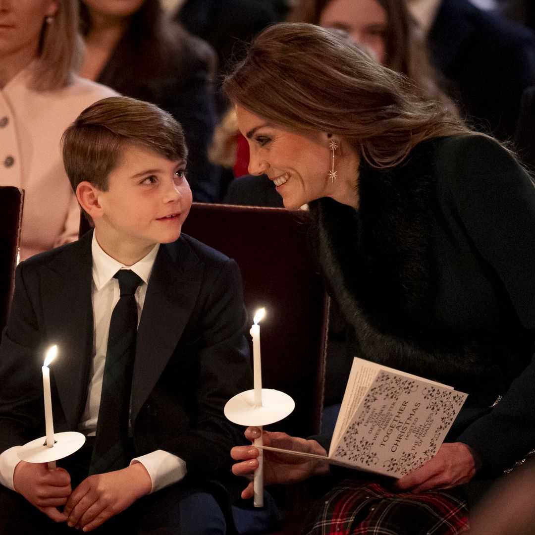 Prince Louis under mum's watchful eye during carol concert