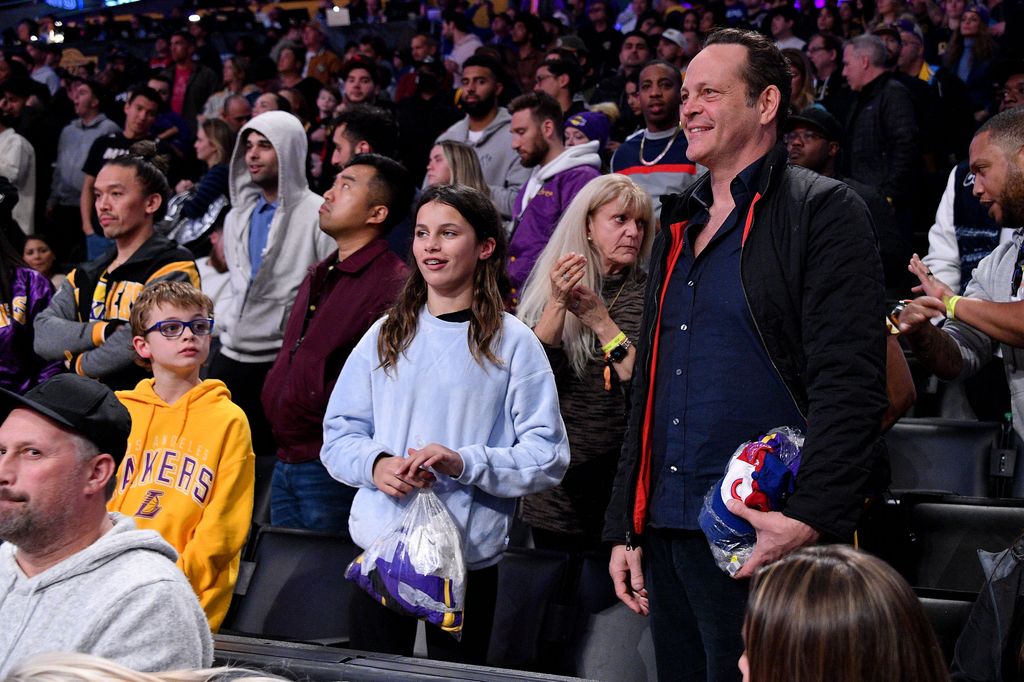 Vince and his children Lochlyn and Vernon attending a basketball game in 2023