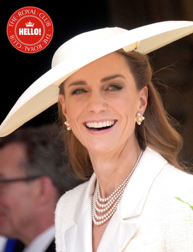 Princess Kate wearing all white, with hat and pearl necklace
