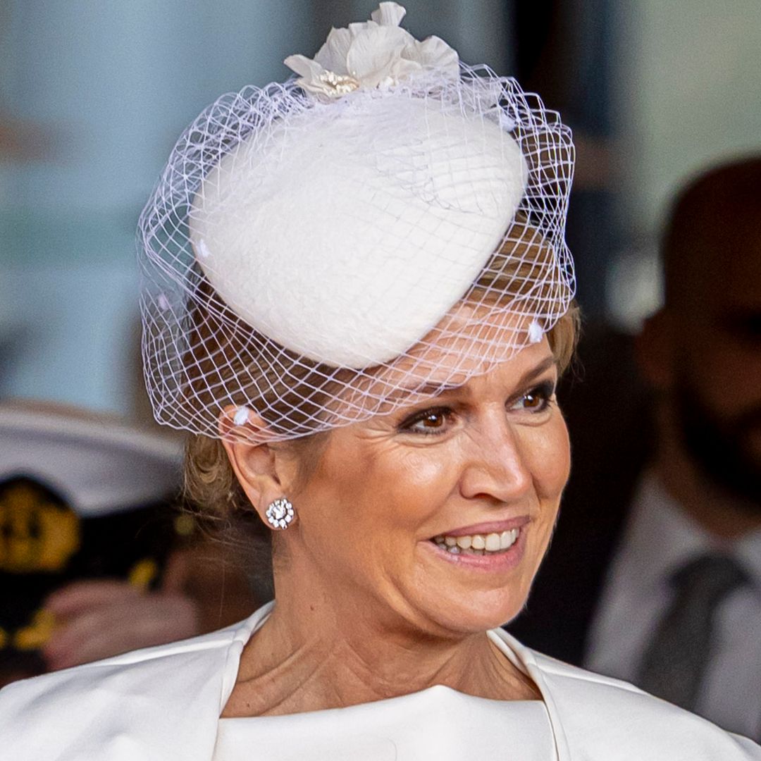 Queen Maxima's bridal white cape dress is a masterclass in styling monochrome in your 50s