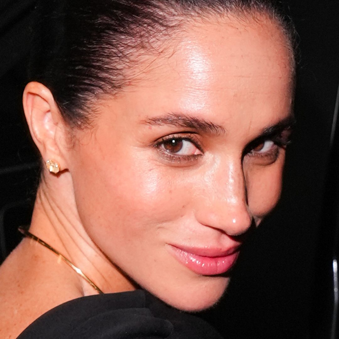 Meghan Markle just boldly recreated Princess Diana's famous 'crossed leg' pose on magazine shoot